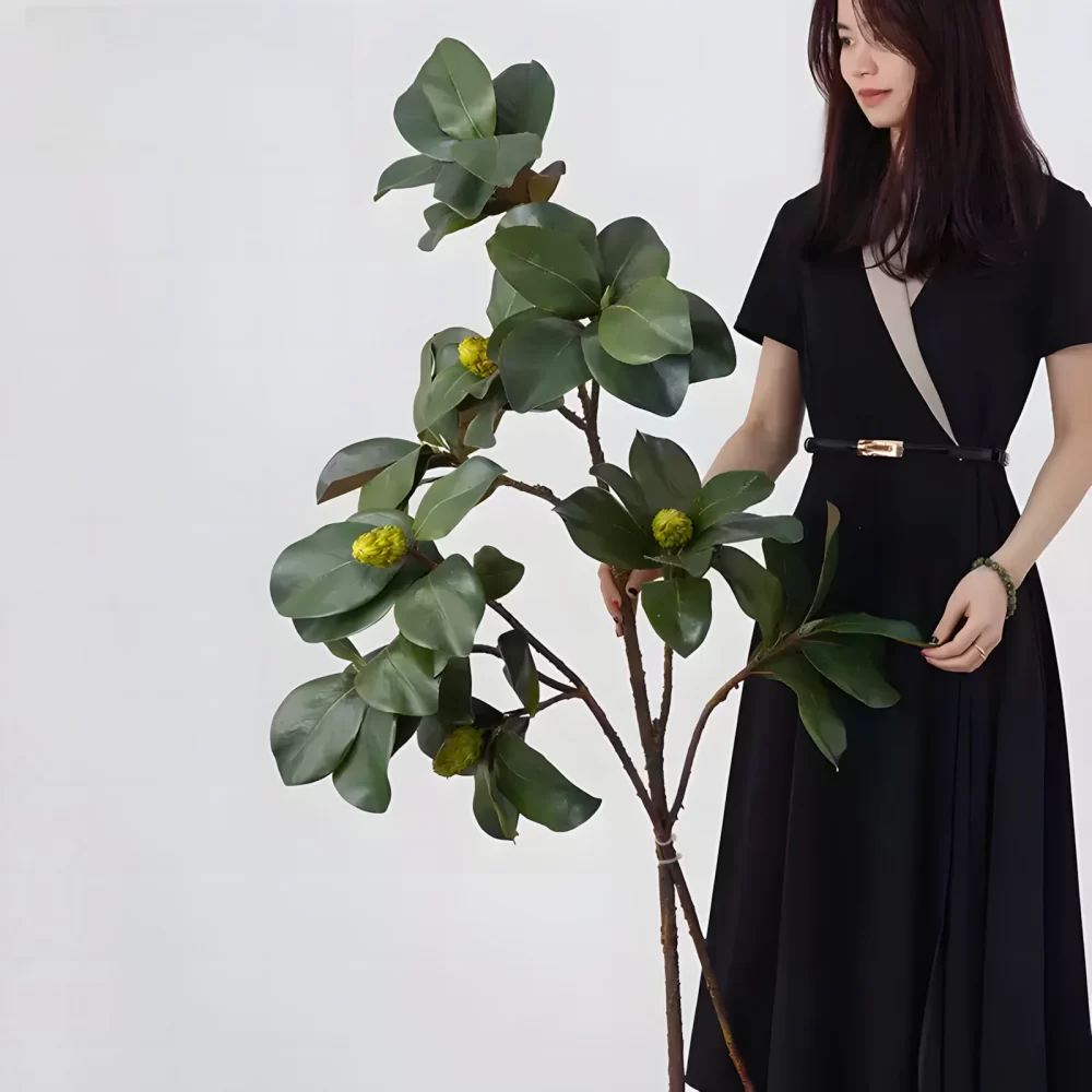 A comparison image featuring two magnolia leaf stems held side by side, one measuring 28 inches and the other 41 inches, showcasing their natural look and versatility.