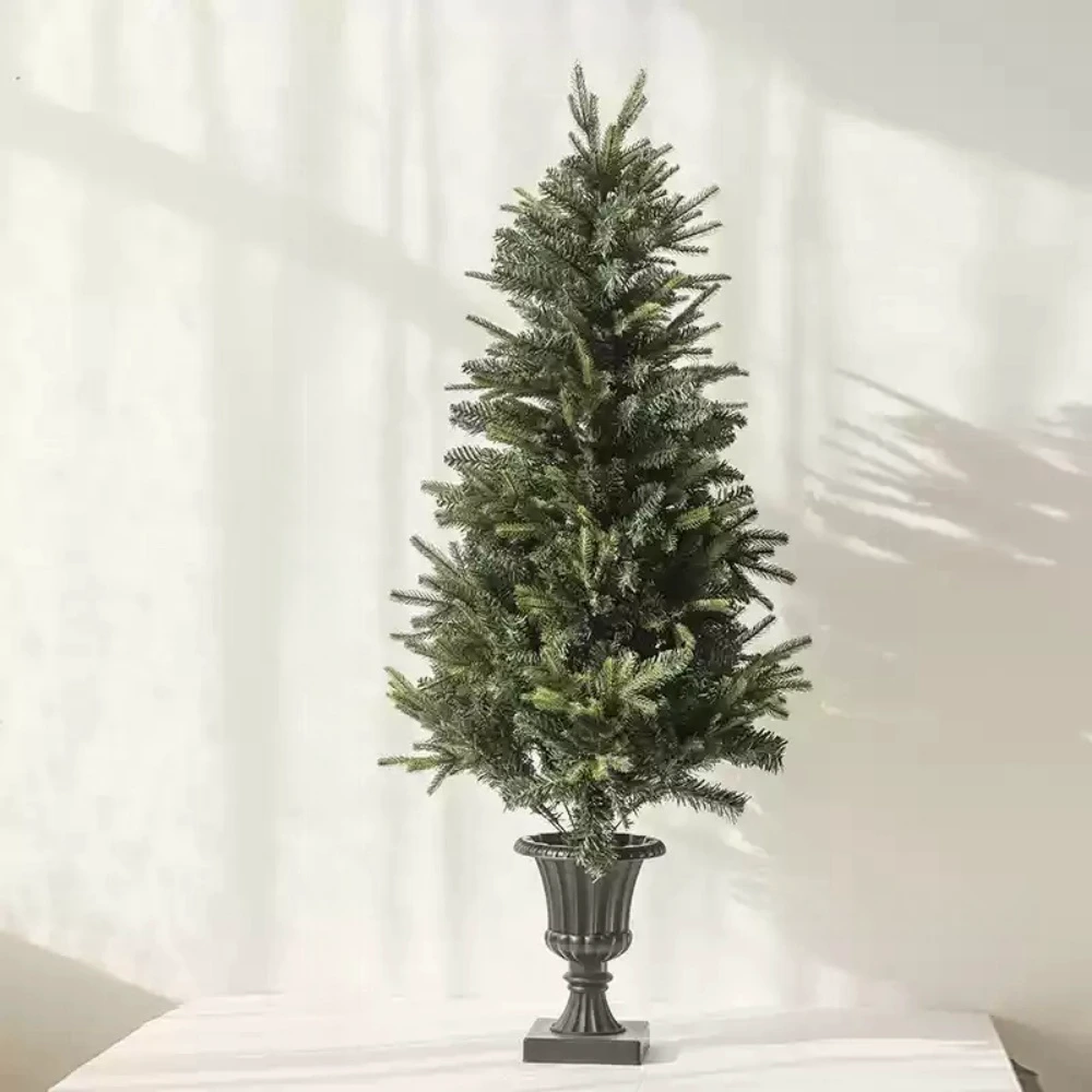 This artificial Christmas tree stands at an impressive 5 feet (150 cm), bringing the festive spirit to any room. Its dense, lifelike branches and elegant, minimalist black pot base make it a versatile choice for seasonal decoration. Ideal for those looking for an easy-to-maintain yet realistic holiday tree.