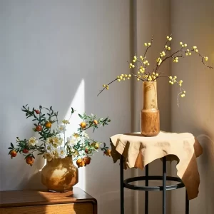 This peaceful arrangement of faux flowers in amber vases, highlighted by warm sunlight, brings a sense of tranquility and nature into any room.