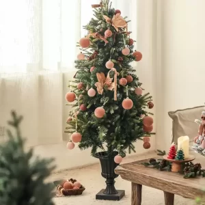 This 5-foot artificial tree, decorated with delicate pink ornaments, brings a fresh and elegant twist to traditional holiday decor. The soft pink accents complement the tree’s lifelike green branches, offering a sophisticated look that adds warmth and style to any holiday setting.