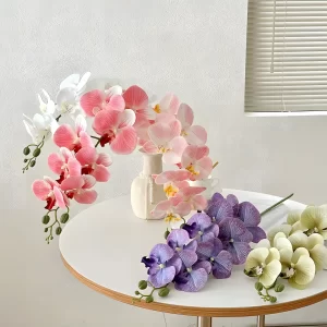 A vibrant assortment of artificial orchid stems in various colors, including white, burgundy, blush pink, lavender, and mint green. These stems offer endless possibilities for creating dynamic floral arrangements for any occasion.